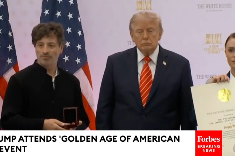 Sergey Brin receives the medal from President Trump