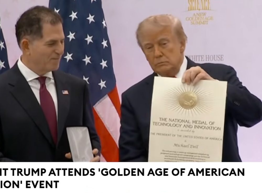 Michael Dell receives the medal from President Trump